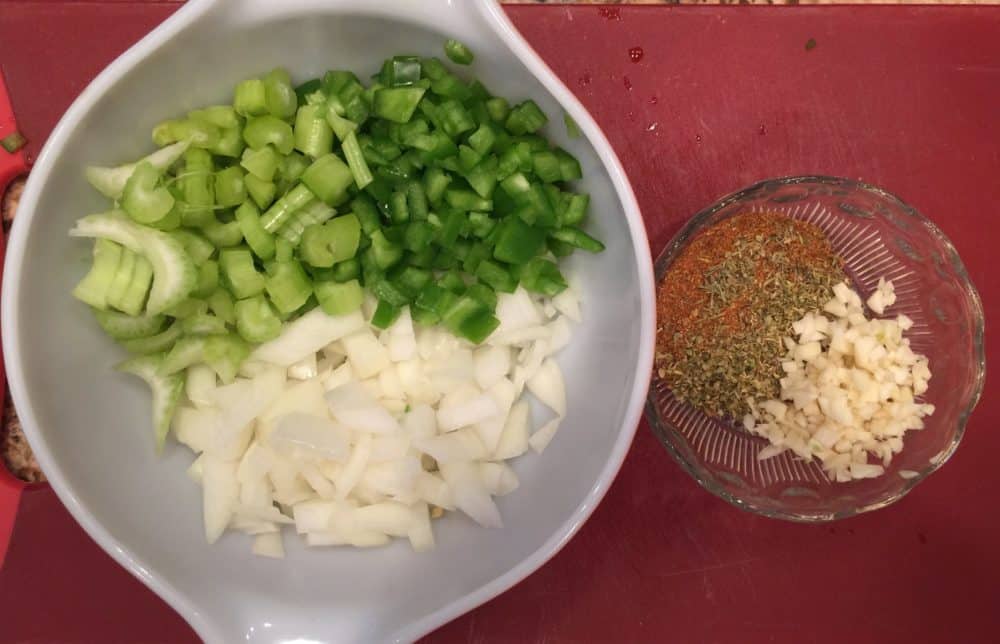 Chopped onions, peppers and celery with herbs, spices and garlic