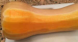 Partially peeled butternut squash.