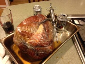 Ham being prepared for cooking.