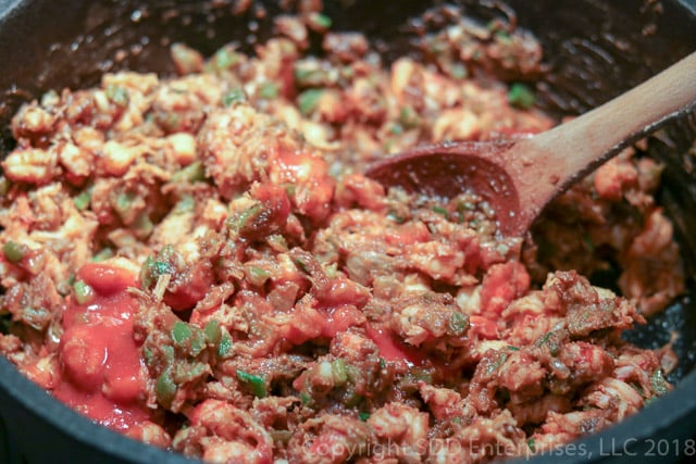 Adding crawfish tails to the Roux Mixture