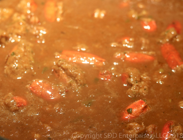 stuffed crawfish heads simmering in the bisque