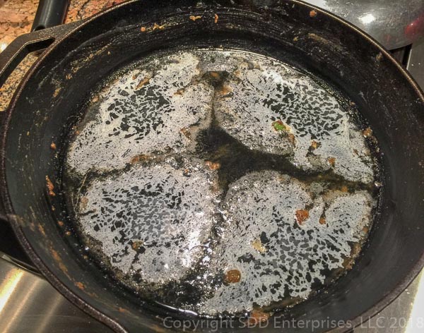 melting butter in cast iron pad after veggie roux mixture removed