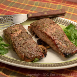 Grilled Cilantro-Creole Mustard Marinaded Salmon on a platter