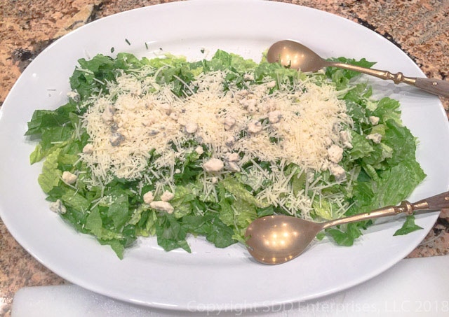 Sensation Salad before tossing on a white platter with salad tongs