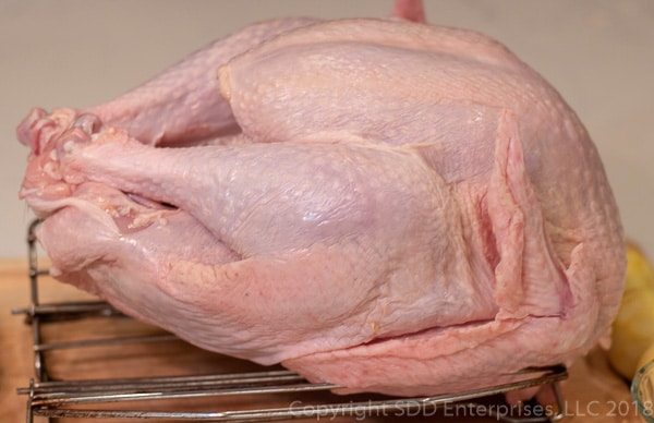 Fresh turkey on roasting rack