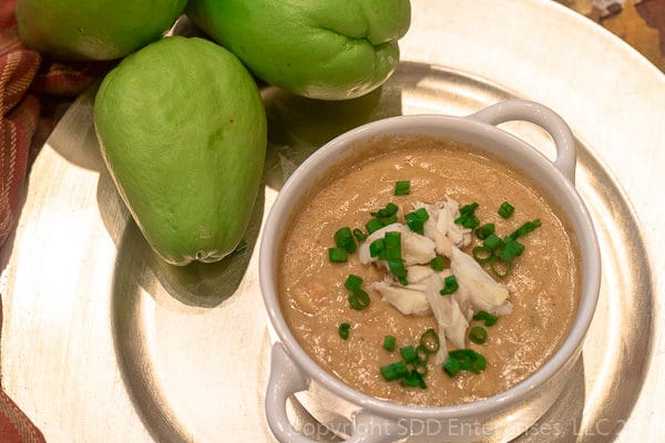 Mirliton Crab Bisque-22 Mirliton Crab Bisque with crab meat in a bowl with three mirlitons