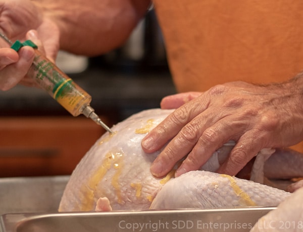 injecting the turkey for fried turkey