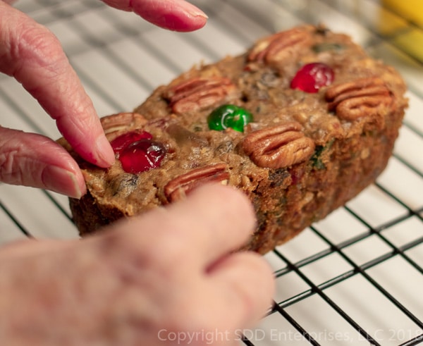 Putting the finishing touches on a fruit cake