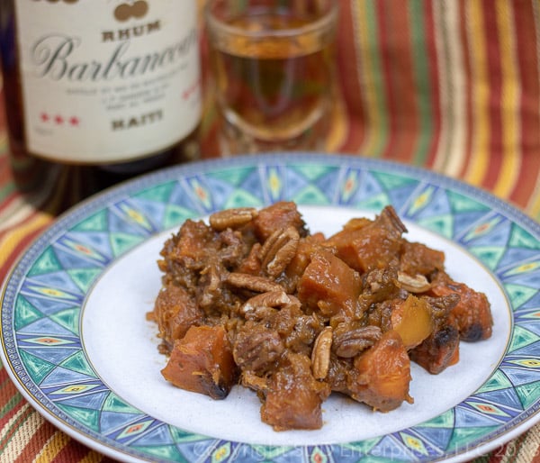 double shot butternut squash on a plate with shot and bottle of rum