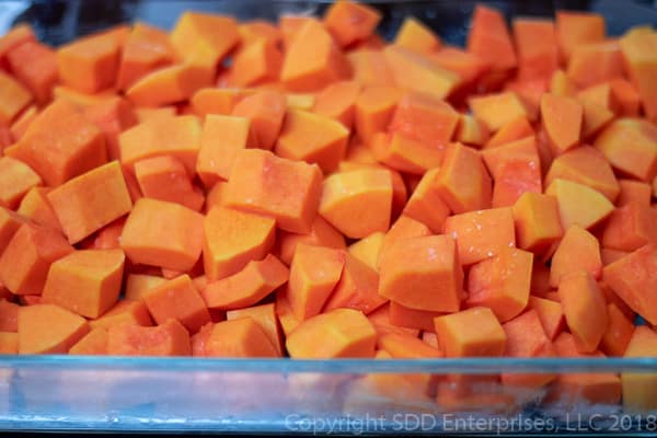 cubed butternut squash in a baking dish