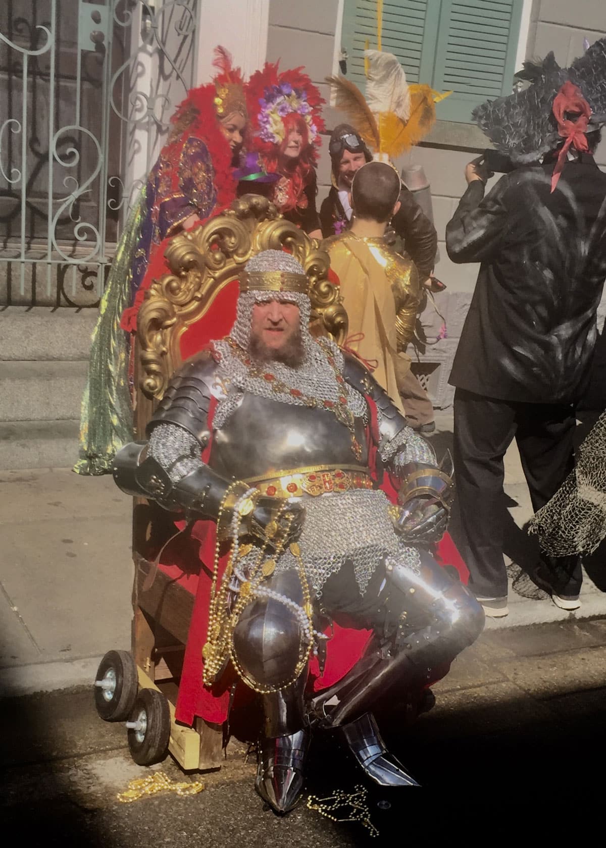 Masker as Knight on a thrown on Mardi Gras Day