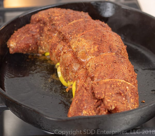 pork tenderloin being seared