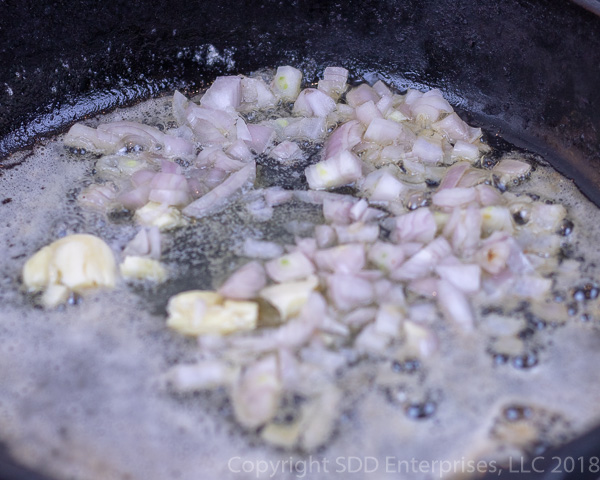 Sauteing the shallots and garlic in butter