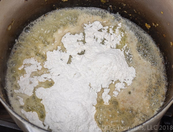 flour added to butter for a roux in a dutch oven