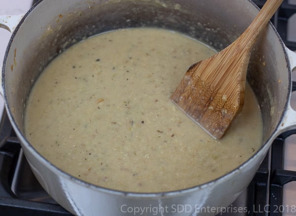 Oyster liquor and stock mixed into the purred vegetables