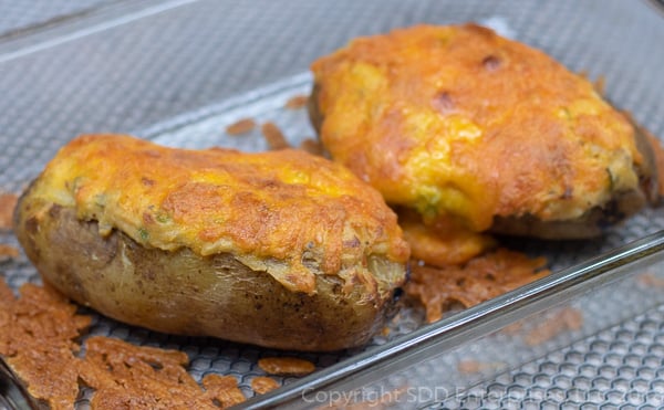 two cajun twice baked potatoes in a baking dish