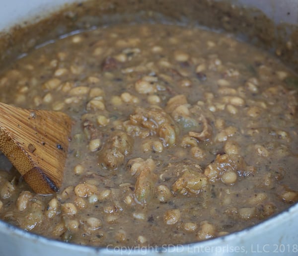 dutch oven with cajun white beans and shrimp