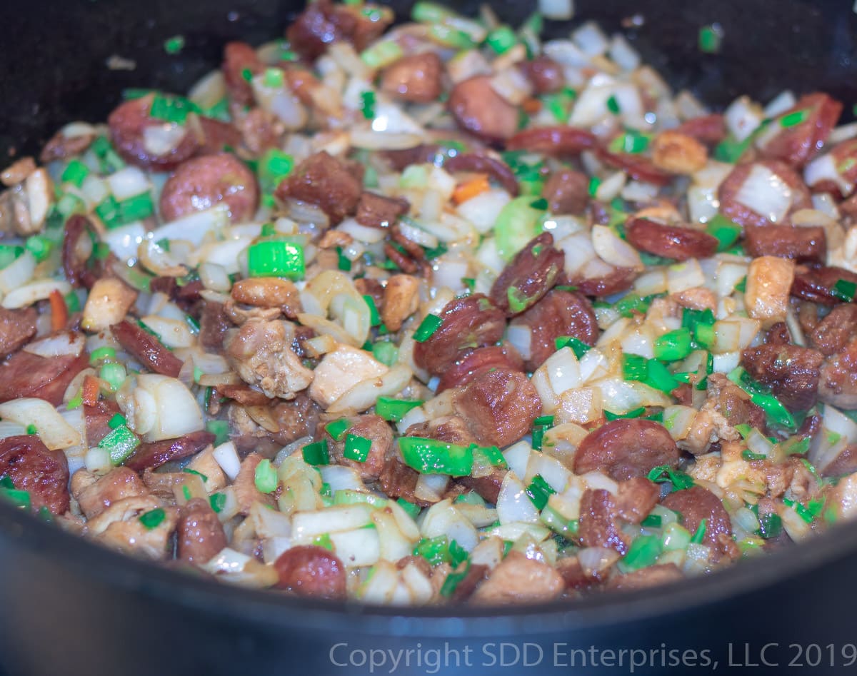 yellow onions, celery, green peppers and green onions added to the dutch oven