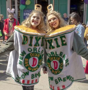 two mardi gras revelers dressed asdixie beer cans