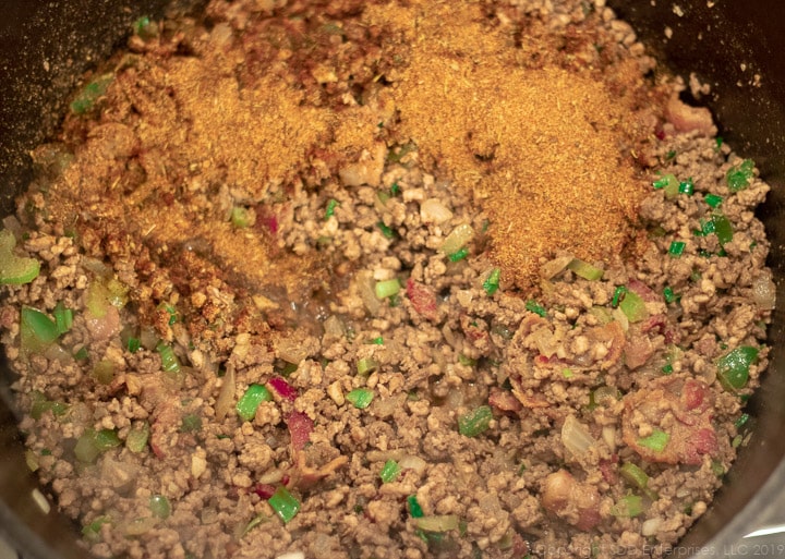 creole seasonings an=dded to the dutch oven with the meats for dirty rice
