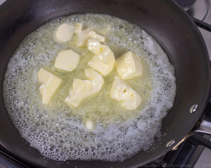 butter melting in a frying pan for meuniere sauce