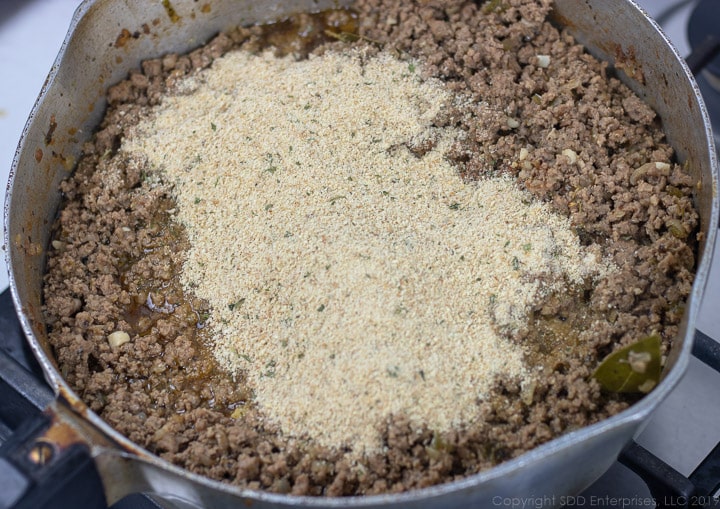 bread crumbs added to browned meat in frying pan