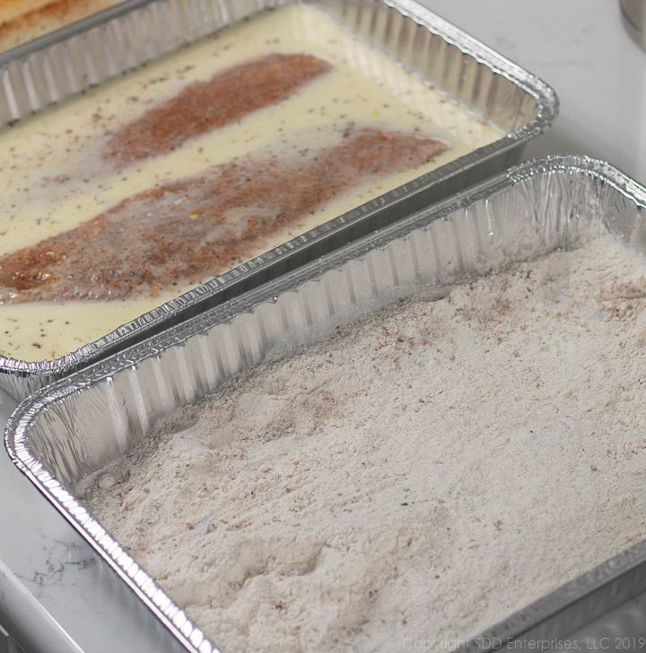 fish filets in egg-milk mix