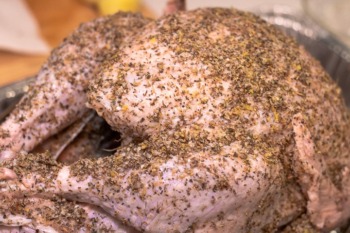 uncooked turkey with dry brine in a pan