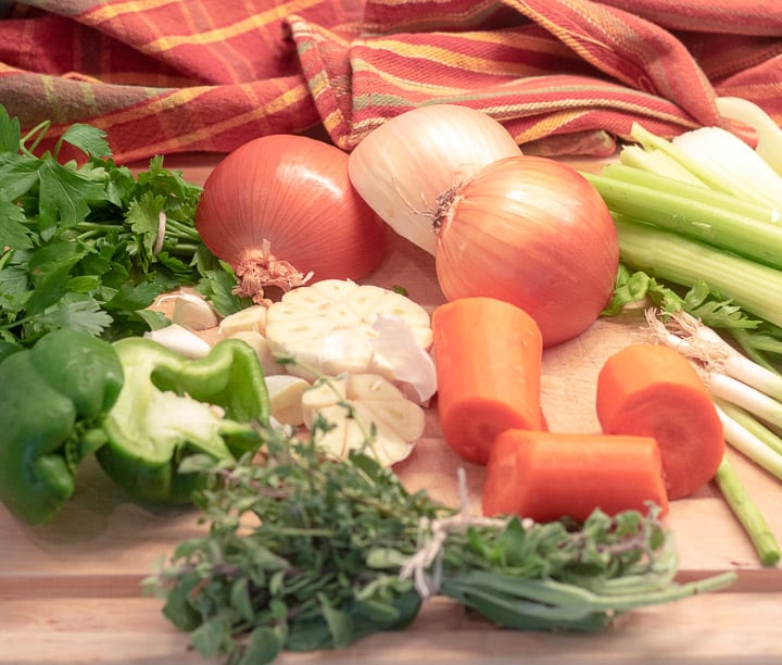 onions, carrots, celery, peppers, garlic and herbs for turkey stock