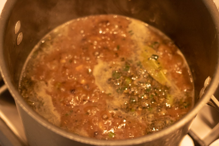 boiling turkey stock used in gumbo in a stock pot