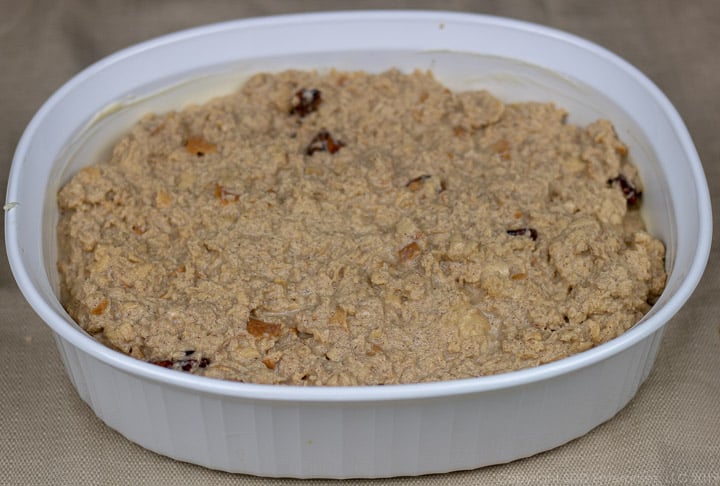 bread pudding ready for the oven in a prepared baking dish