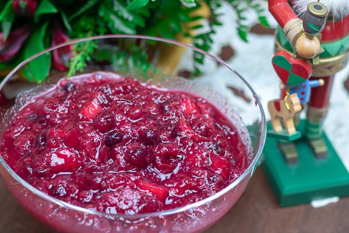 cranberry relish in a glass bowl with holiday decorations
