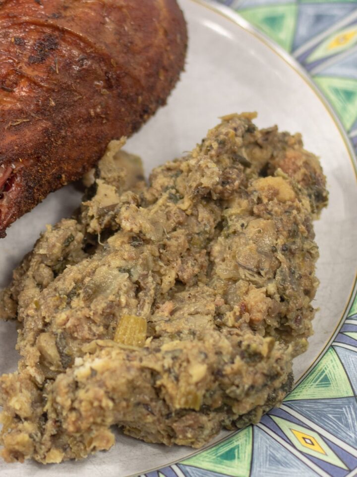 oyster dressing on a plate with a turkey leg