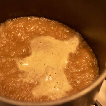 turkey stock boiling in a stock pot