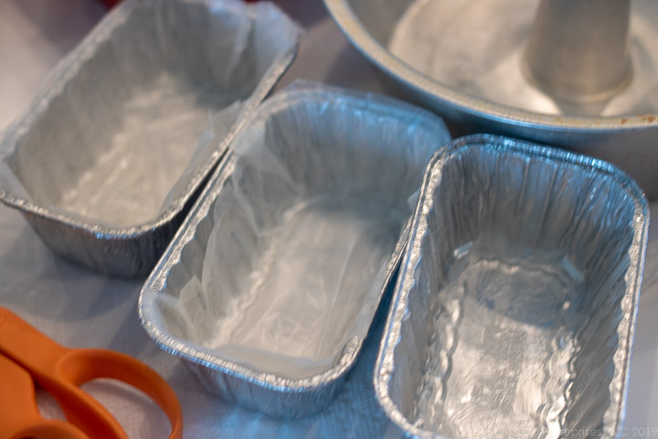 Aluminum loaf pans with wax paper for fruitcake.