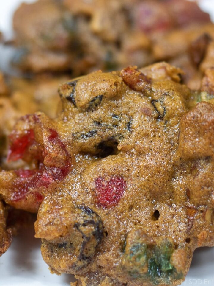 several fruitcake cookies, or Christmas Lizzies on a white plate