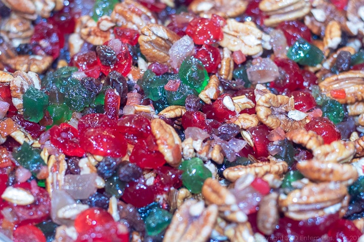 mixed candies fruit, rasins and nuts in a bowl for fruitcake cookies