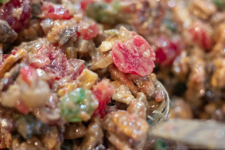 fruitcake cookie batter and candied fruit mixed up