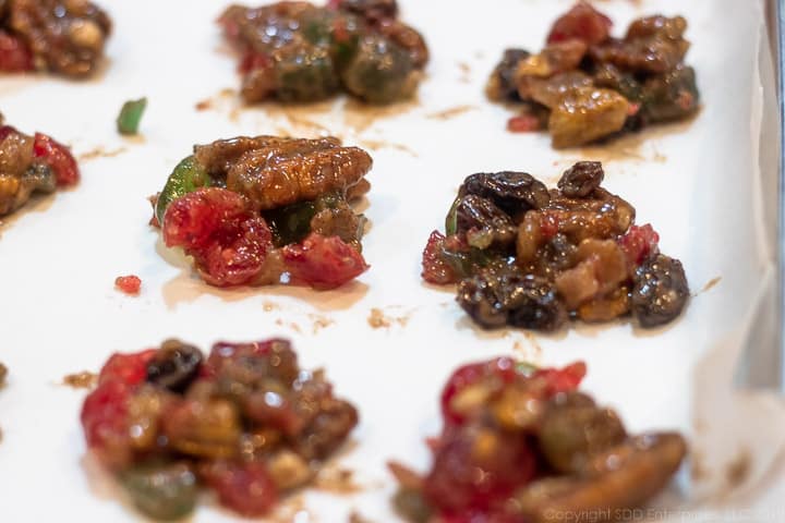 fruitcake cookies on a cookie sheet ready for the oven