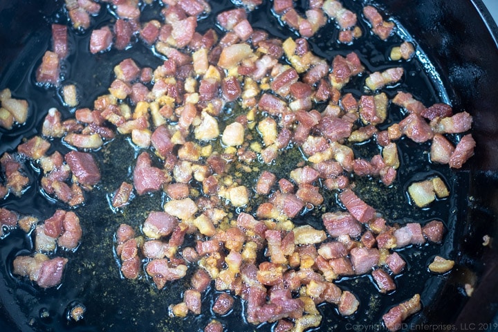 pancetta fried in a cast iron pan