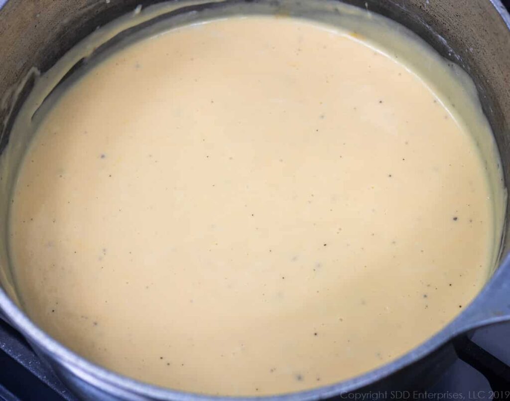 blended cheese sauce for macaroni and cheese in a sauce pan