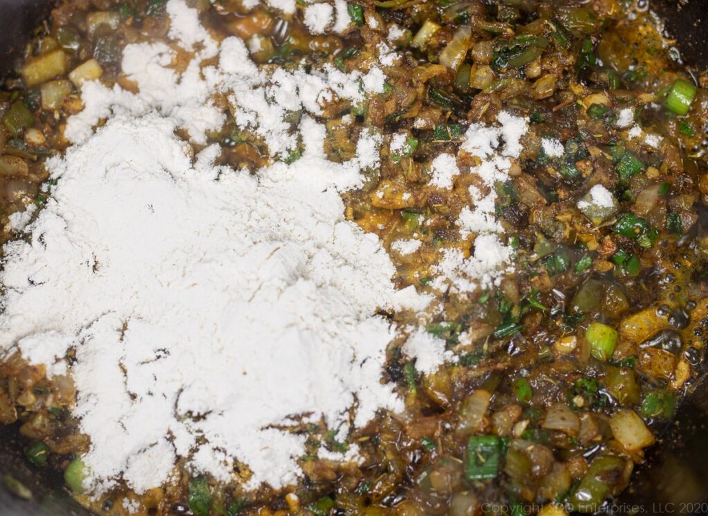 flour added to cooking vegetables in a dutch oven