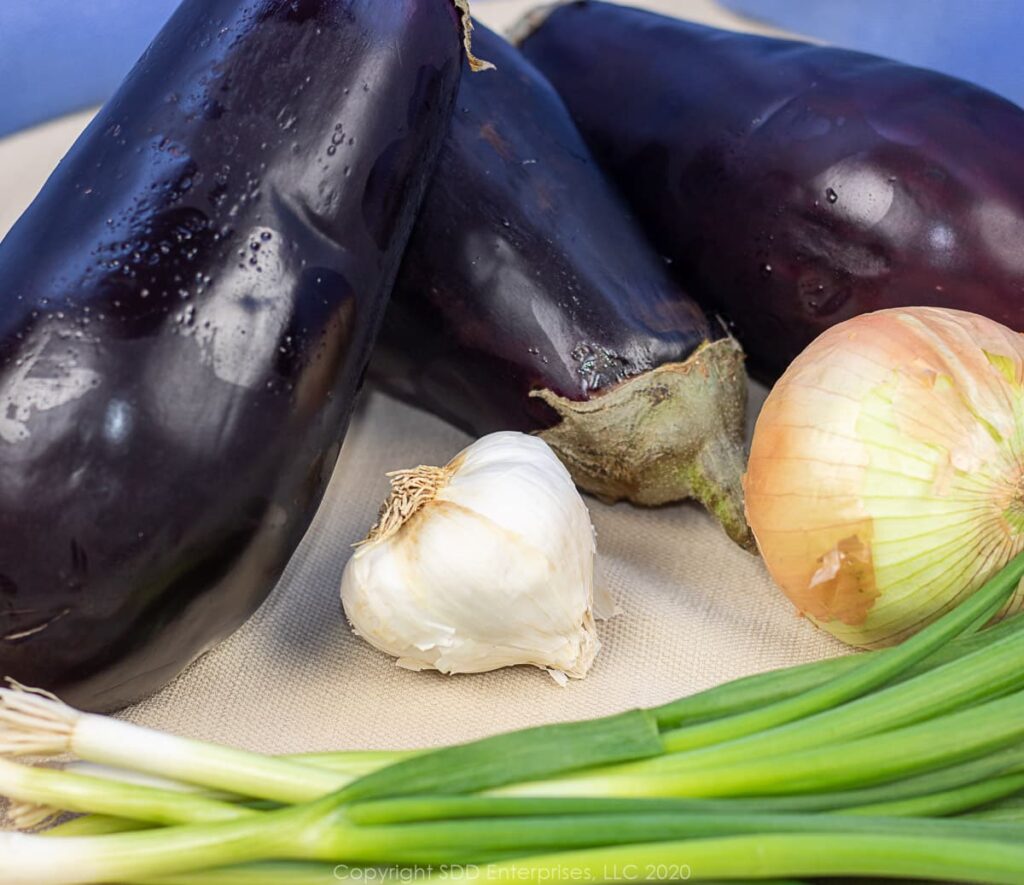 eggplnats, garlic, yellow onion and green onions