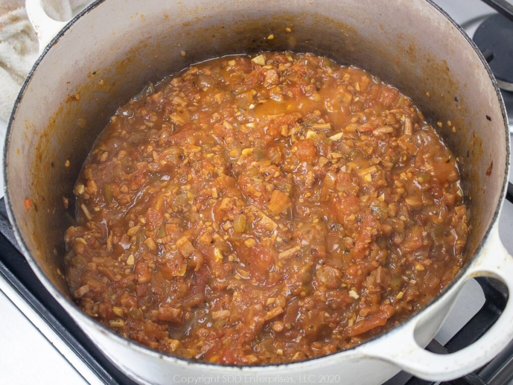 tomatoes and vegetables reduced in a dutch oven