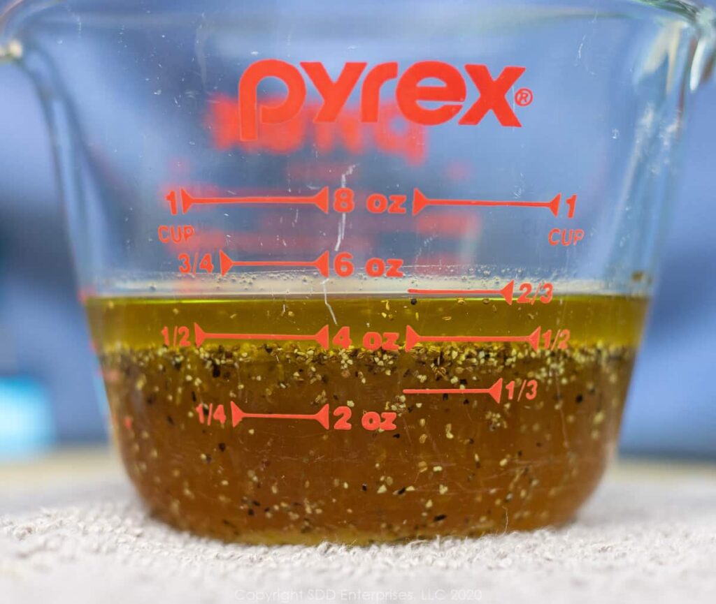 dressing for slaw in a measuring cup