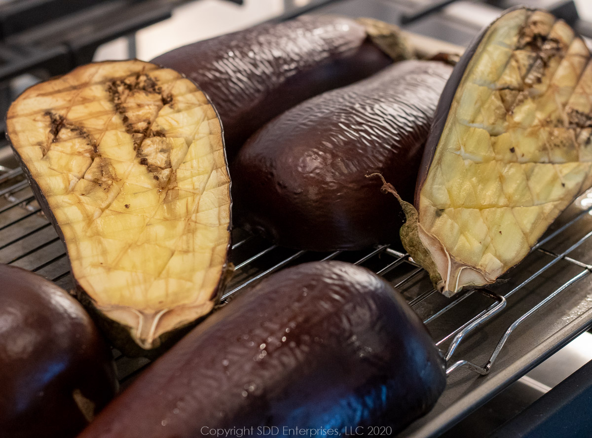 roasted eggplant halves on a cooling rack