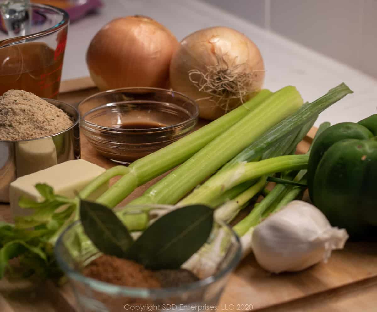 ingredients for stuffed eggplant on a cutting board