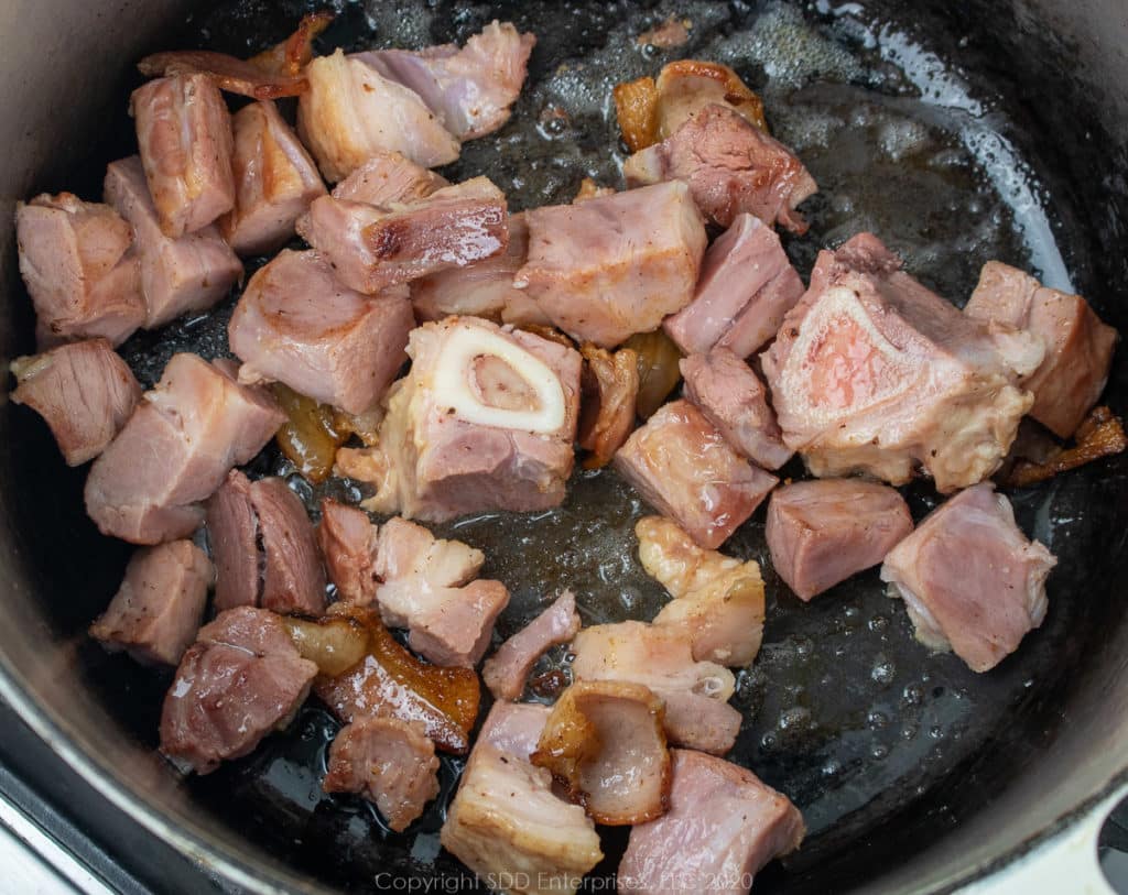 cubed ham and smoked bacon in a dutch oven