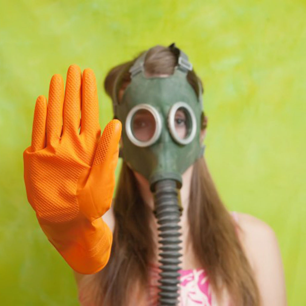 girl with gas mask and orange rubber glove