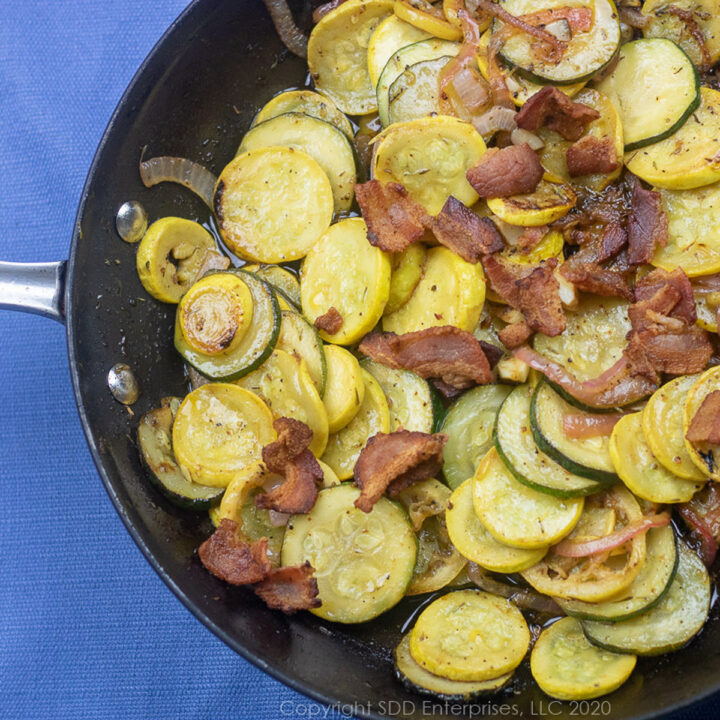 sauteed zucchini and yellow squash in a fry pan